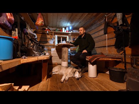 We live in a taiga hut with a dog. We lead a simple life and work on the trails.