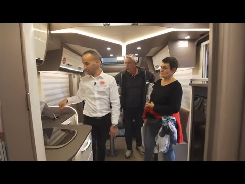 At the motorhome show, they're planning their dream holidays