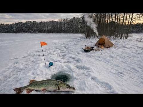 Winter camping by the lake hot tent, fishing and dog