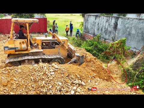 Fast Job! Komatsu D53A Bulldozer Pushing Stones Filling Corner & Dump Trucks Dumping Stones Landfill