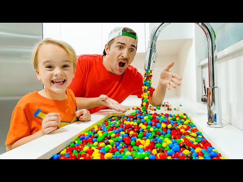 Chris plays with magic faucet and toys