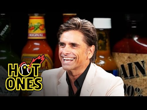 John Stamos Falls Out of His Chair While Eating Spicy Wings | Hot Ones
