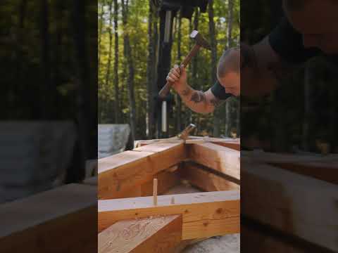 Assembly and raising of a modified king post truss.