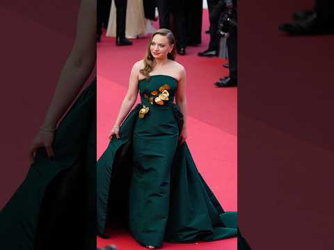 Mia Threapleton is radiant in a custom emerald gown with gilded leaves for the Cannes Film Festival.