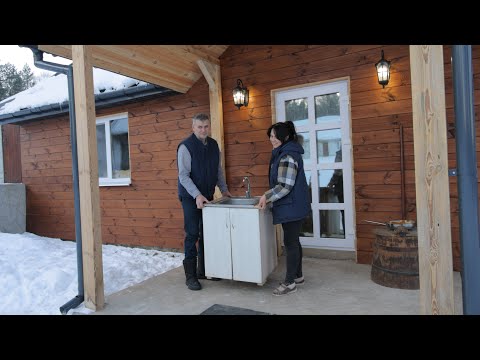 Village Family Life in the Snowy Winter. Settling a bathroom and baking buns