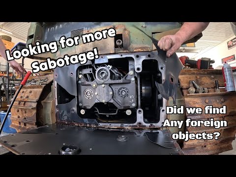 Looking for more foreign material inside the low hour broken military John Deere dozer