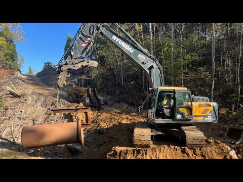 Installing The Overflow And Rock On The Abandon Quarry Dam