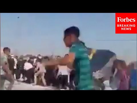 WATCH: Gunfire Heard As Palestinians Flee Humanitarian Aid Site Amid Chaos