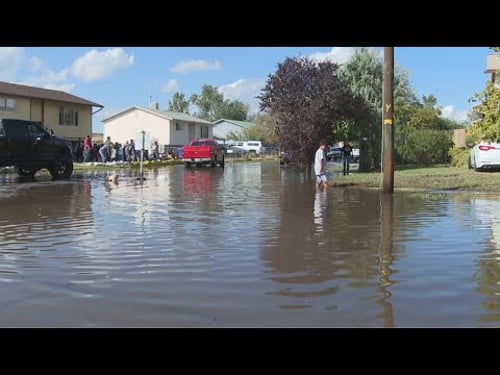 Residents come together to help clean up after damaging floods in Salt Lake