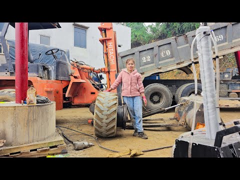 Quickly repair the tire of the wheel loader by the girl mechanic