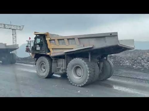 Mining Dump Trucks Working at Full Capacity – Heavy Equipment in Action