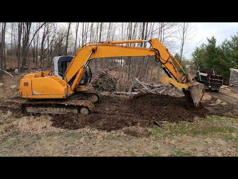 Grading around my septic with excavator and skid steer