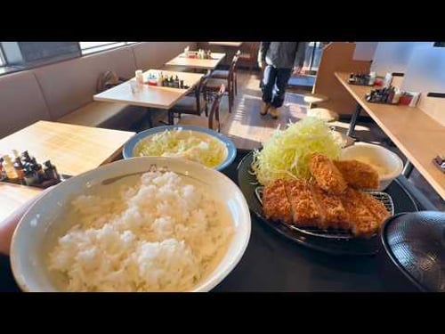 A Japanese nurse eating tonkatsu and fried oysters for lunch after a night shift