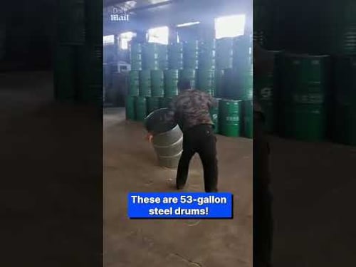 Factory worker hurls steel drums with amazing accuracy