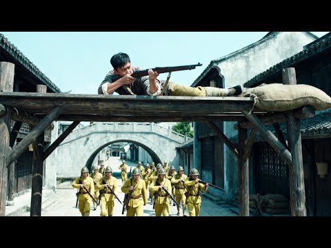 Japanese high official parades through the streets—only to be taken out by a sudden sniper strike.