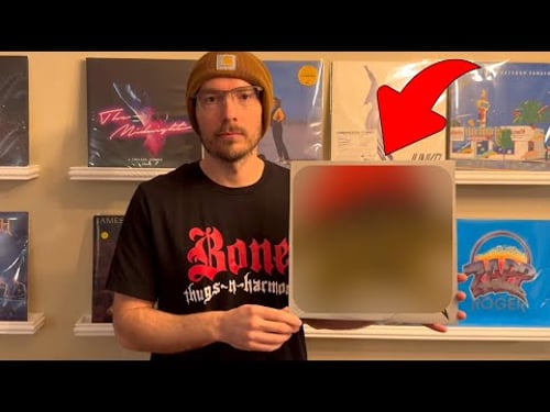 I found an album signed by a killer AND HIS VICTIM!