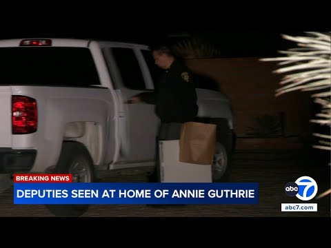 Deputies carrying boxes from home of Annie Guthrie, sister of 'Today' co-anchor