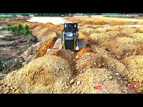 Extreme Power Shantui Bulldozer Pushing & Spread Soil Pile With Many Hyundai Dump Trucks Landfilling