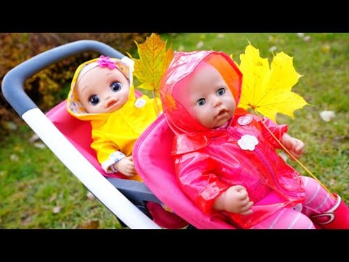 Baby Annabell doll & Baby Alive doll can't share rainy boots and a raincoat before going for a walk.