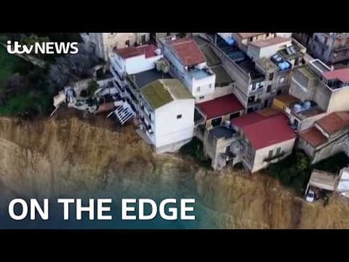 Dramatic drone footage shows houses on cliff edge after landslide | ITV News