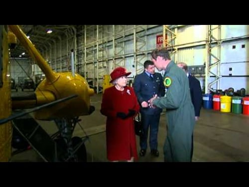 Prince William shows Queen Elizabeth II an RAF Search and Rescue helicopter