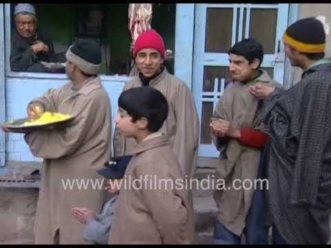 A Man in Kashmiri Attire shares food with locals