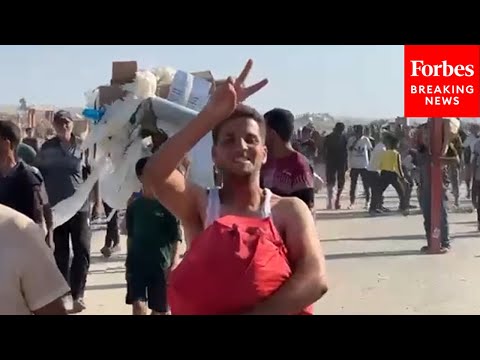Palestinians Depart Aid Site In Gaza Carrying Humanitarian Aid
