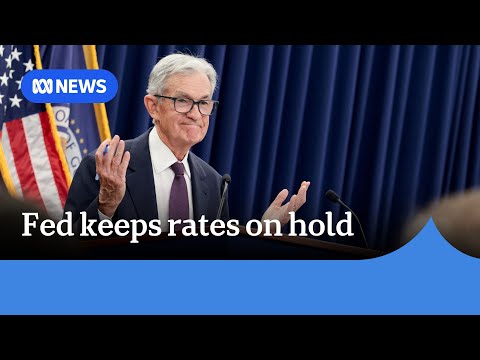 US Federal Reserve leaves interest rates on hold in defiance of Trump | ABC NEWS