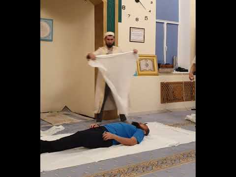 Қайтыс болған кісіні жуындыру және кебіндеу