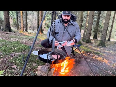 Cooking on the fire in the woods and flying a Harris hawk 