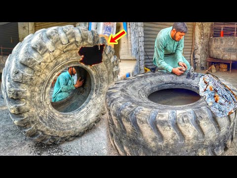 Hard working Young man Repairing Gaint Caterpillar Loader Tire | Heavy Duty LoaderTire Repair |