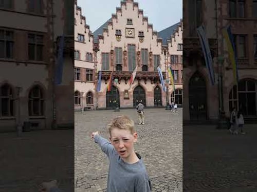 11 yr gives tour of Romerberg in Old Town Frankfurt Germany