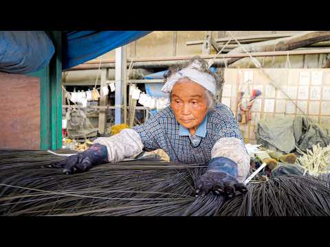Old family run factory where traditional Japanese craftsmen manufacture tatami products.