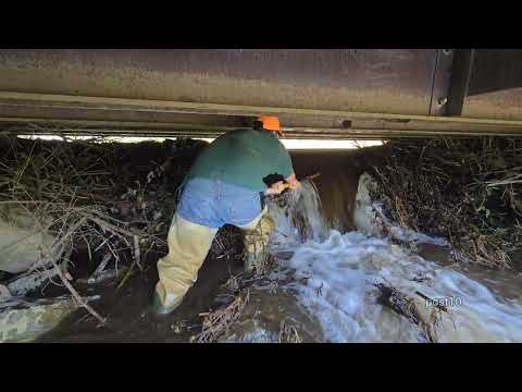 Completely Draining Flooded Pond By Unclogging Bridge With Massive Surge Of Water