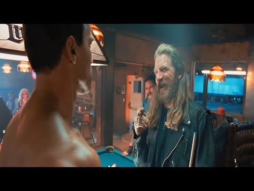 A tough-looking biker puts his cigar out on a new patron’s chest, not realizing he's confronting a..