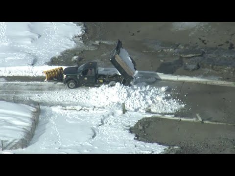 Mass. crews work overtime to clear thousands of cubic yards of snow