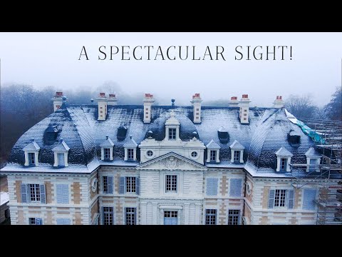 The Château doors mended whilst snow descended!