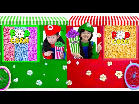 Andrea and Charlotte Colorful Popcorn Teamwork at the Cinema