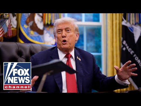 President Trump signs executive orders from the Oval Office