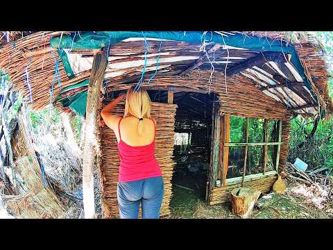 A Woman Builds a Reed Hut Alone