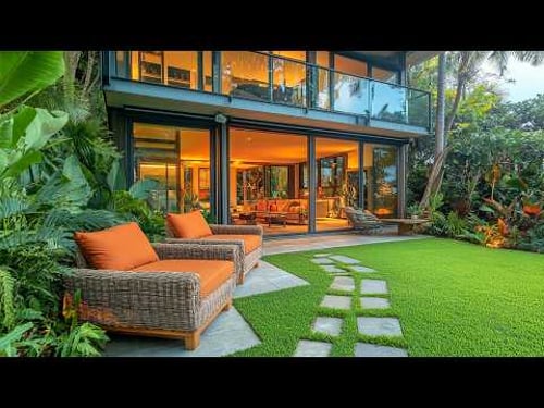 Stunning Tropical House with Lush Greenery Perfect Outdoor Living Space