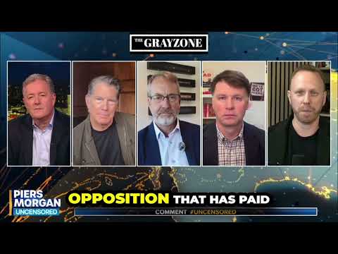 Max Blumenthal wipes smile off US official's face