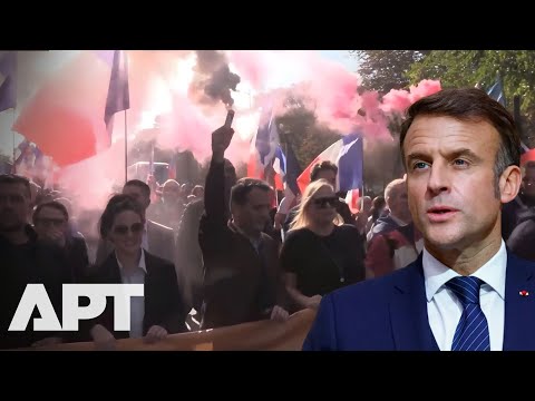 ‘Clings to Power Like a Madman’: Macron Slammed by Furious French Crowd | APT