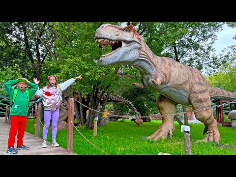 Giant Dinosaurs in kids Park with Sofia and Max