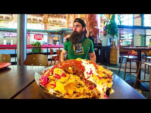 ATTEMPTING AN UNEXPECTEDLY SPICY NACHO MOUNTAIN CHALLENGE | BeardMeatsFood
